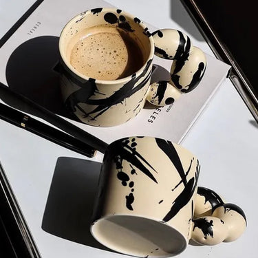 Handmade cream ceramic Cup with Black Splashes